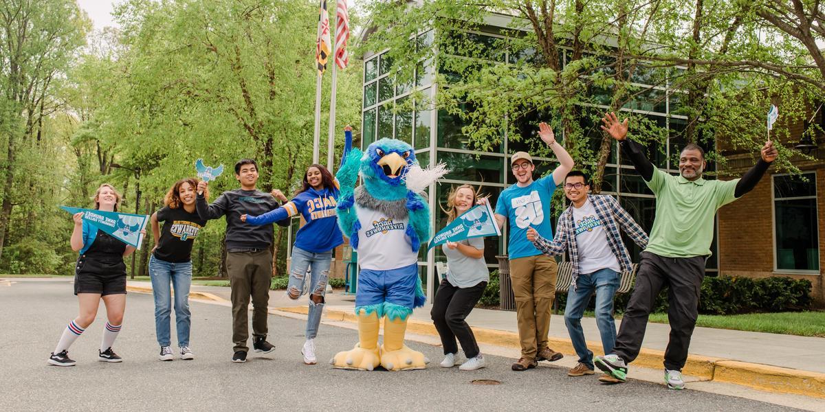 AACC students posing outside with Swoop.